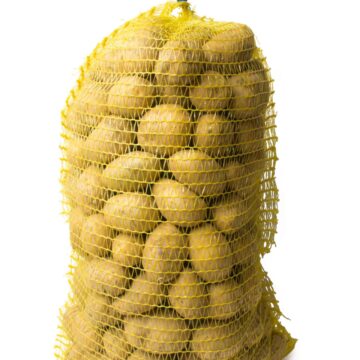 Potato.,Medium,Potatoes,In,A,Yellow,Net.,Shooting,Isolated,On
